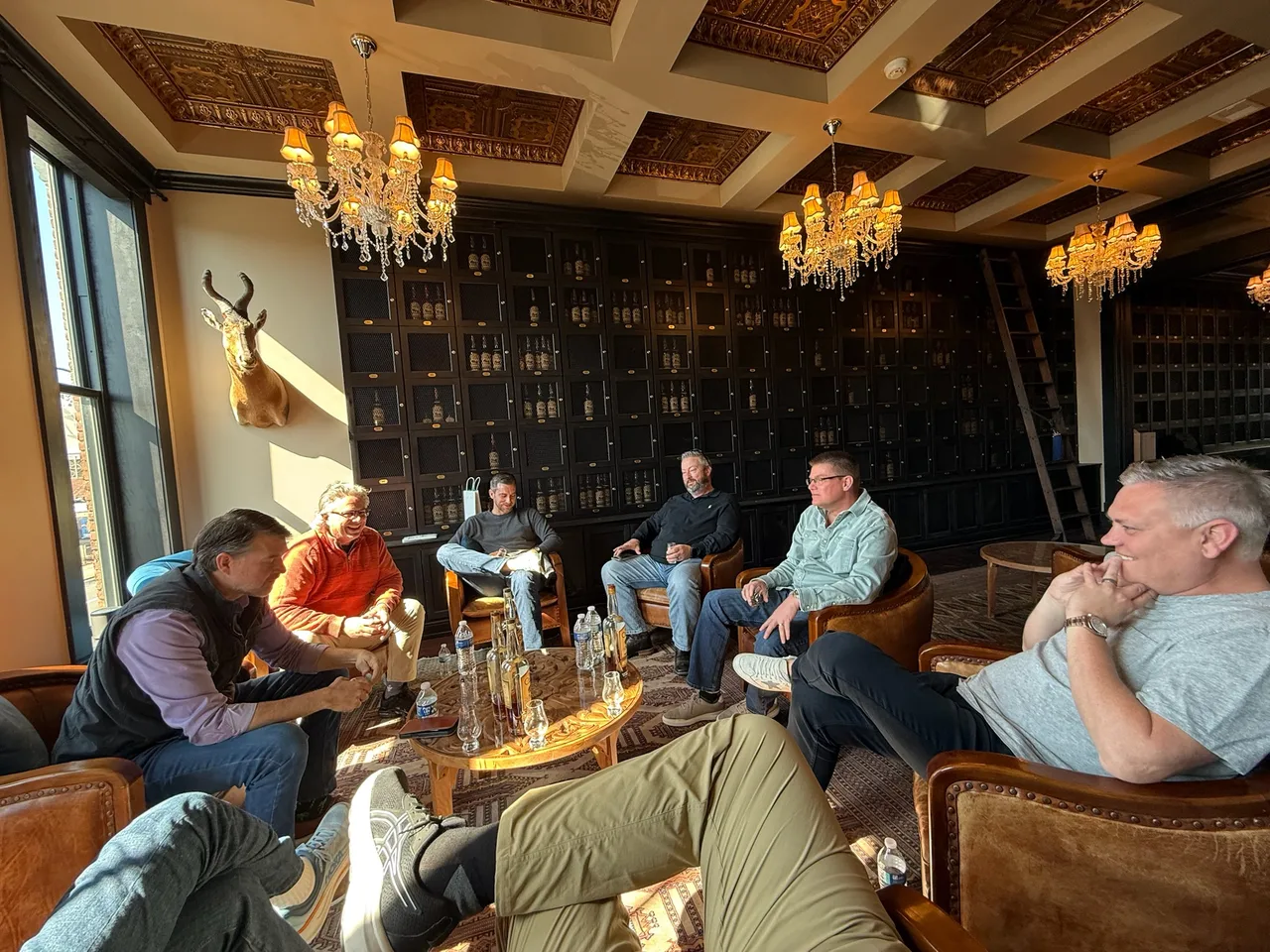 Members gathered around a table during a producer visit.