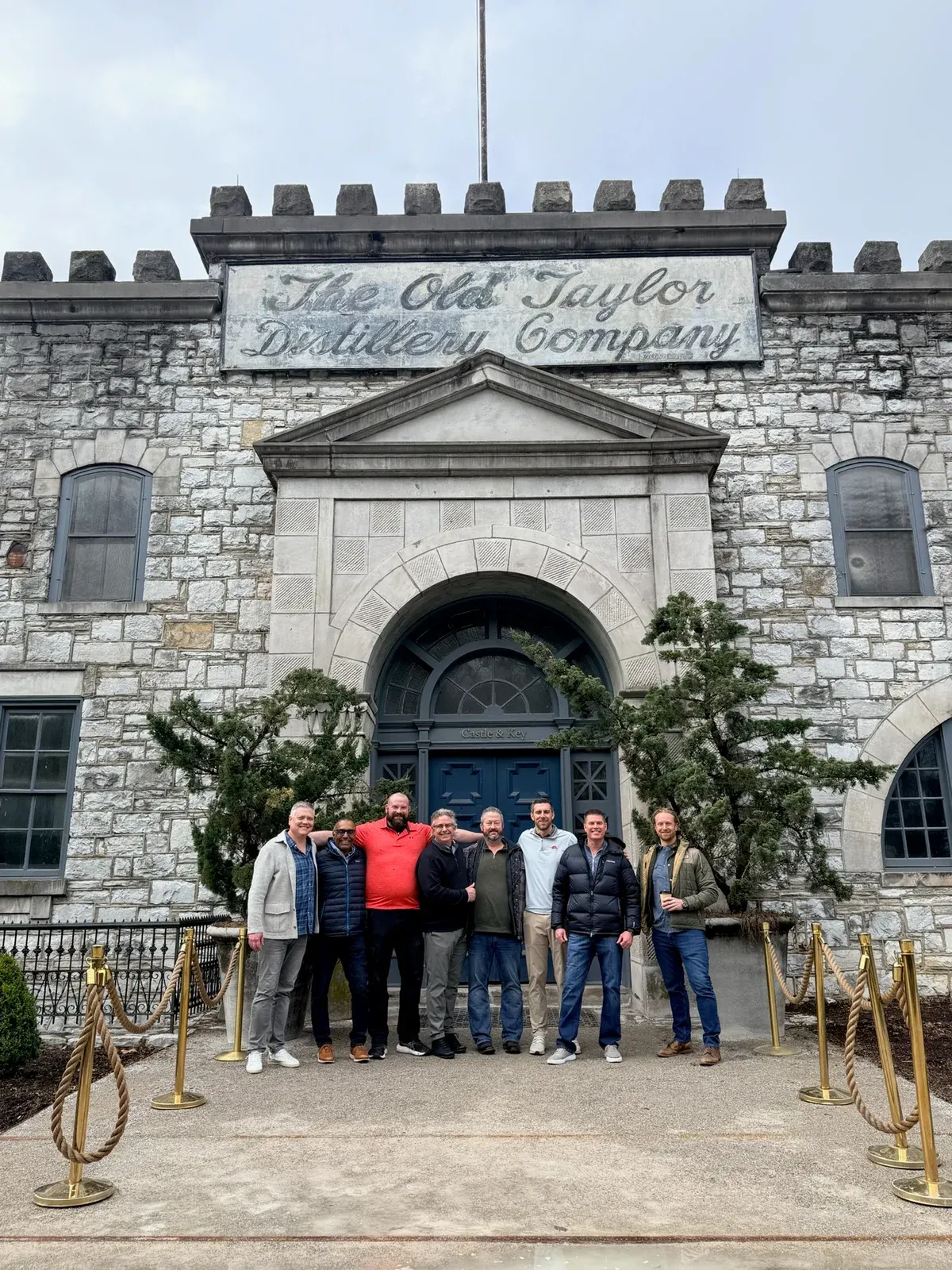 The group outside the historic stone Castle & Key distillery.