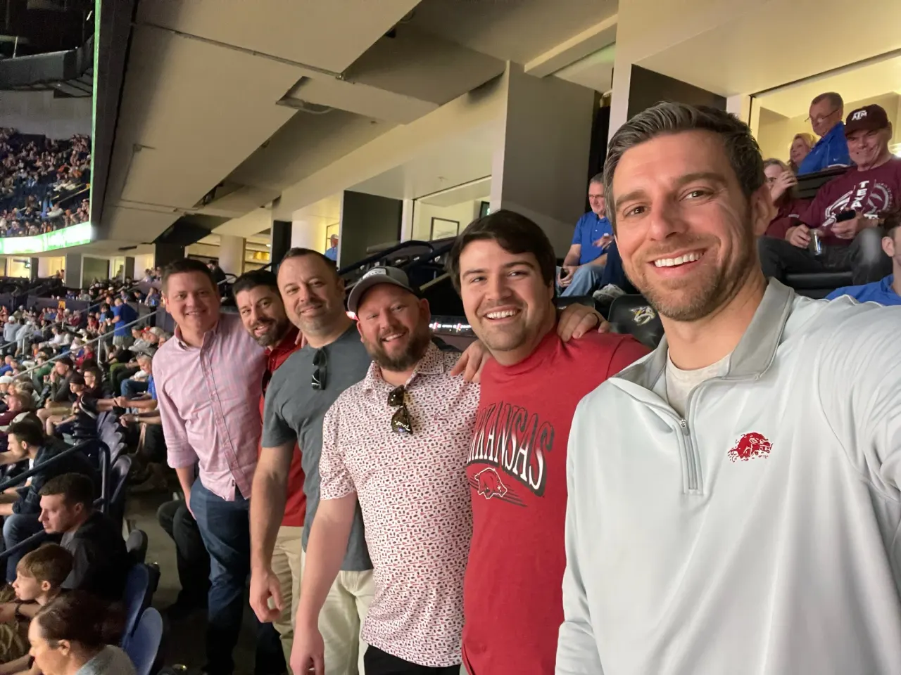 Members together in the stands at a basketball game on a Nashville trip.