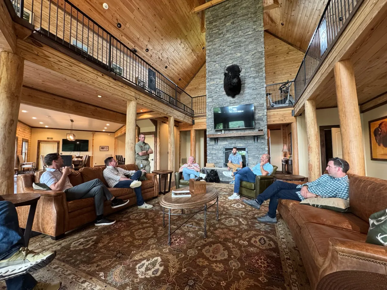 The group relaxing together inside the timber-lined Stagg Lodge.