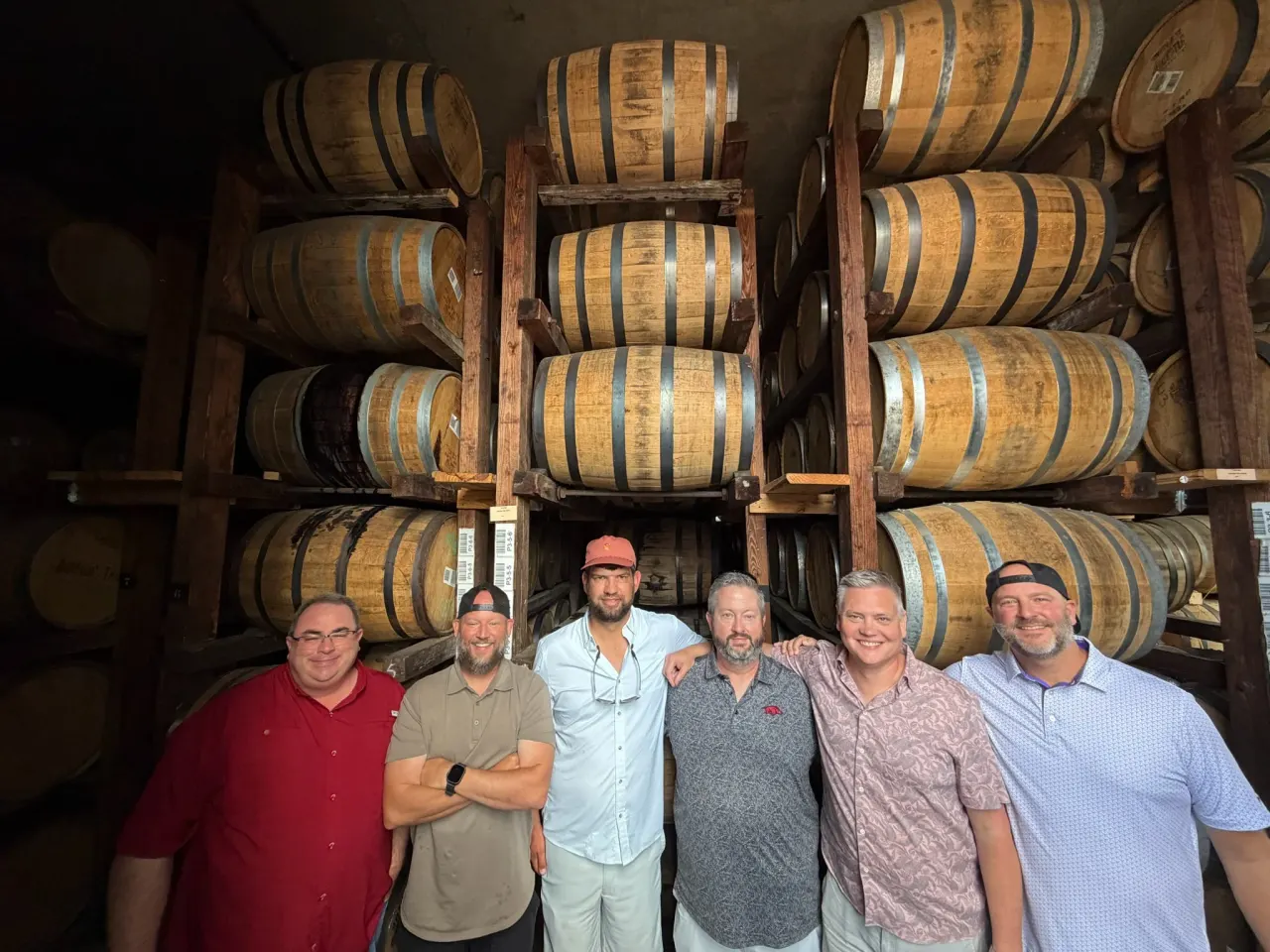The group with rows of barrels on the E.H. Taylor selection trip.