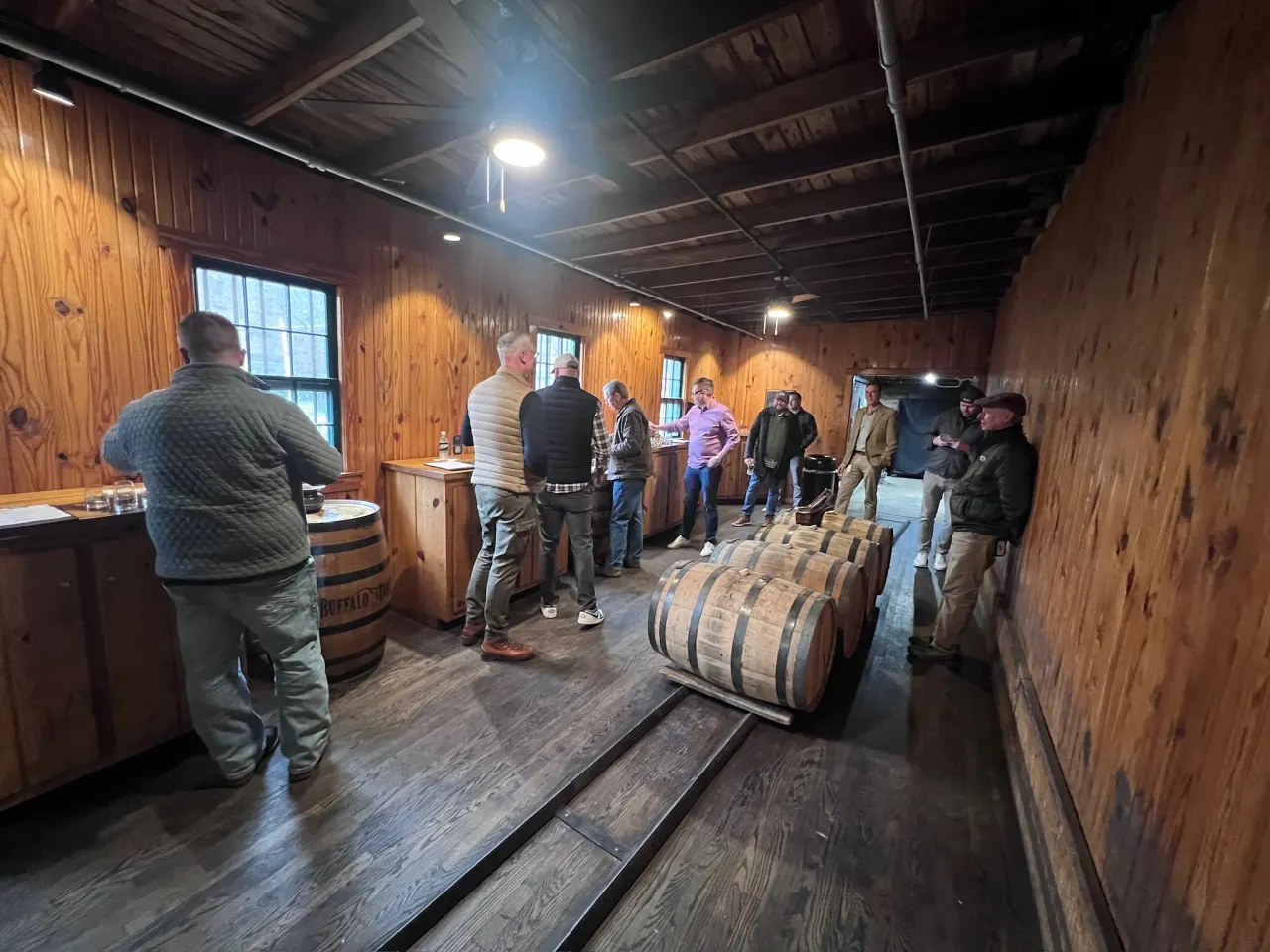 Members tasting and comparing candidate barrels together.